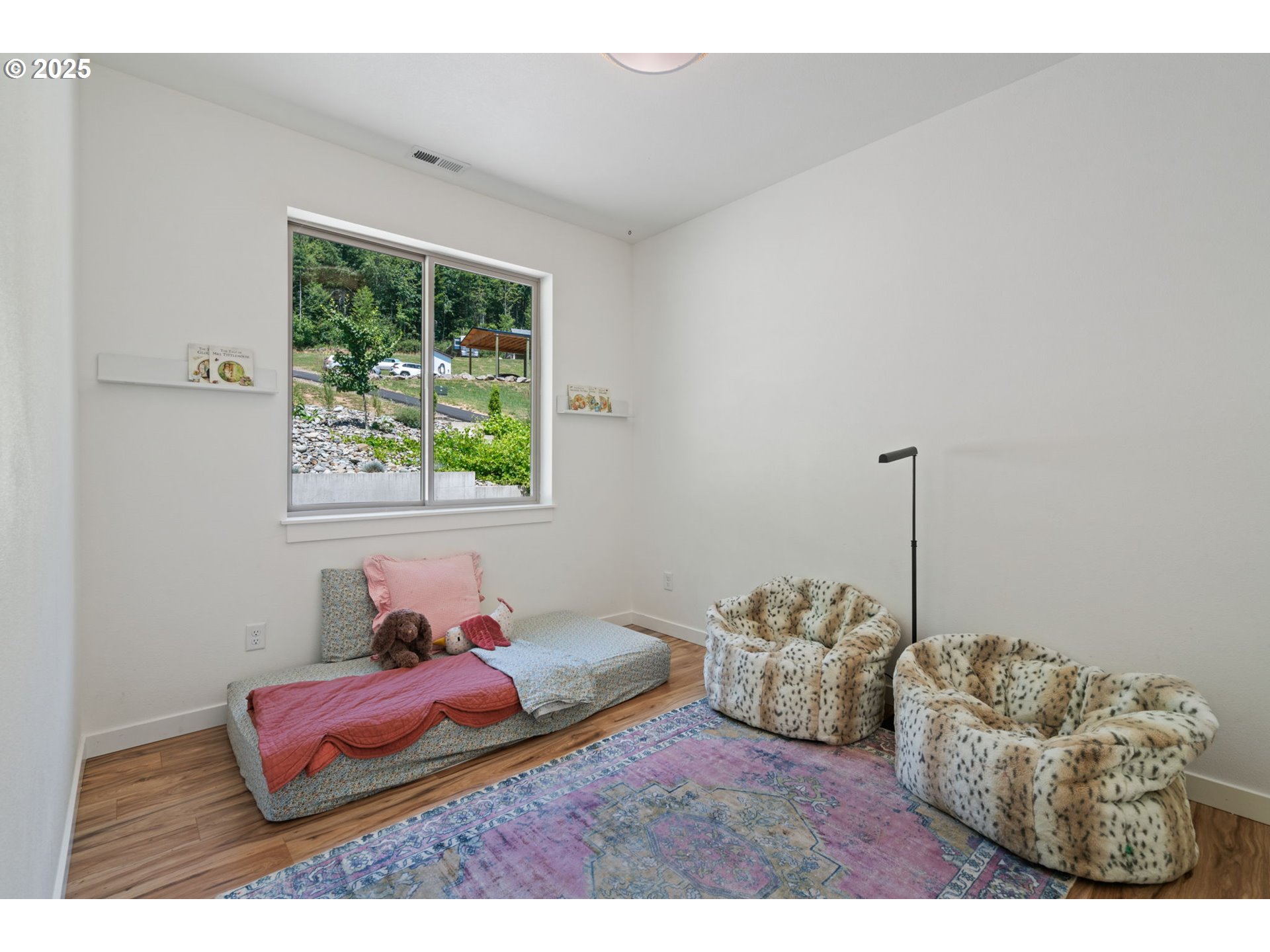 5601 Lewis River Road Ariel, WA 98603 - Photo 26 of 48 a bedroom with furniture and a window