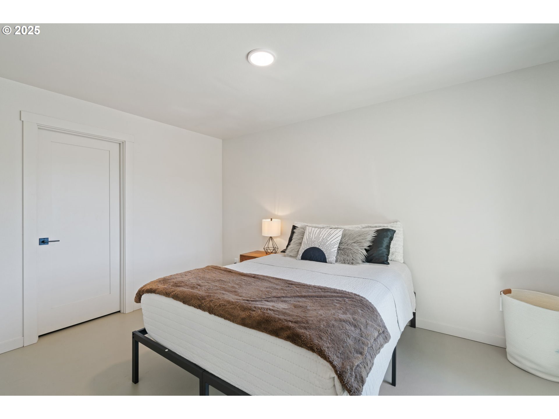 5601 Lewis River Road Ariel, WA 98603 - Photo 39 of 48 a bedroom with a bed and a night stand