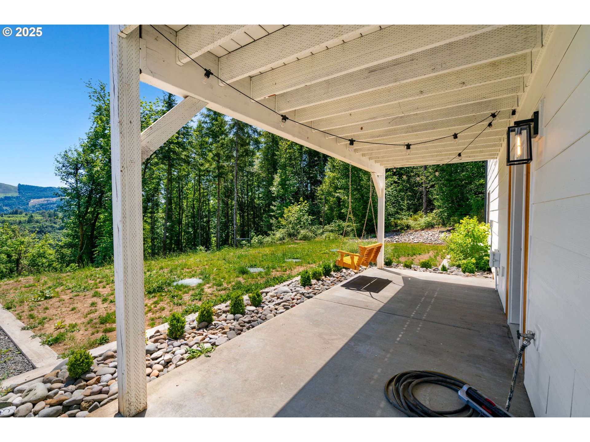 5601 Lewis River Road Ariel, WA 98603 - Photo 40 of 48 a view of a porch with furniture and garden