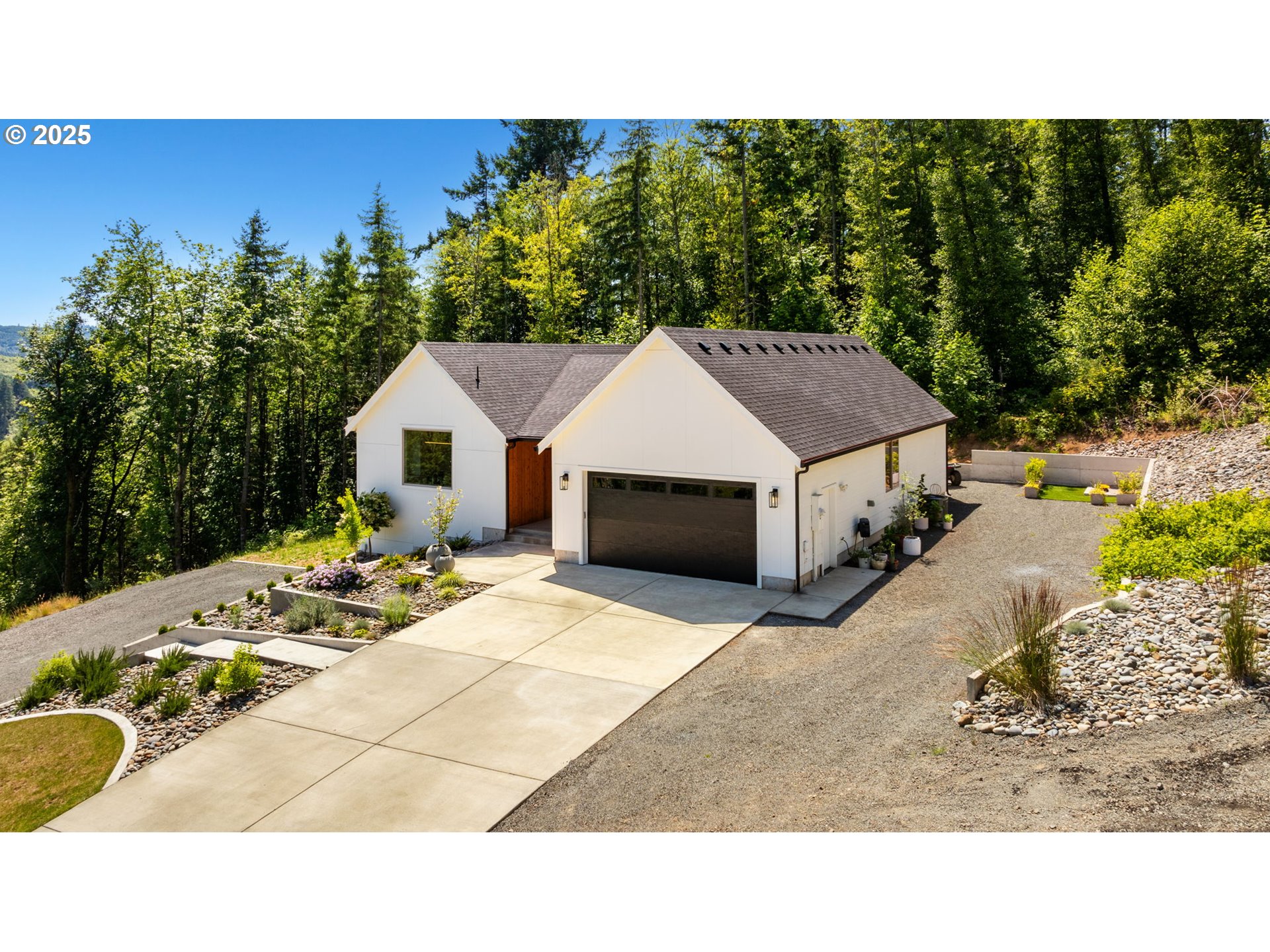 5601 Lewis River Road Ariel, WA 98603 - Photo 44 of 48 a view of a house with backyard