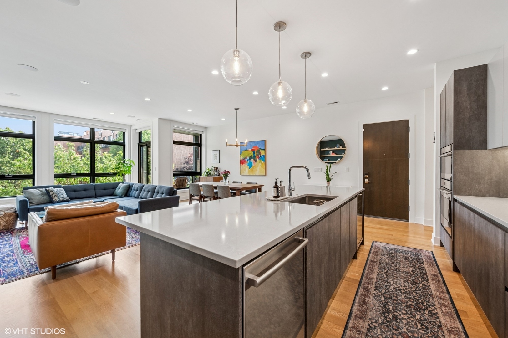1156 West Ohio Street, Unit 2E Chicago, IL 60642 - Photo 11 of 30 a kitchen with counter top space a sink appliances and windows
