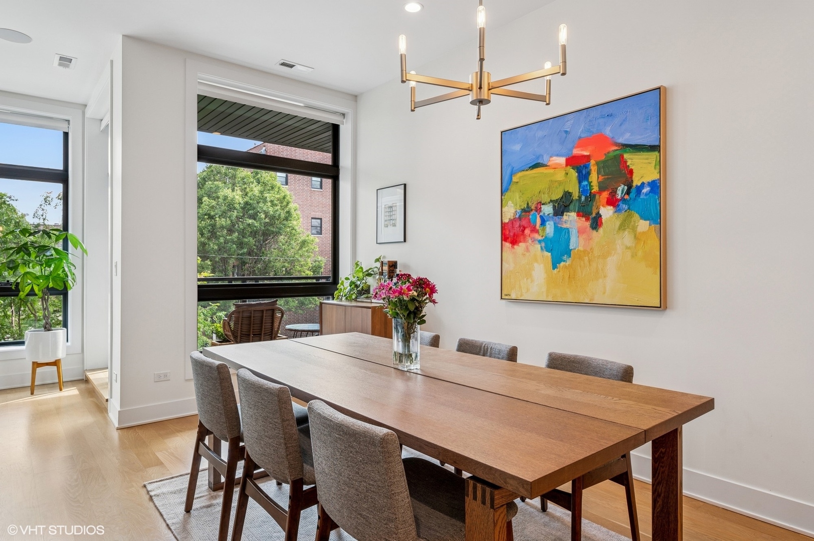 1156 West Ohio Street, Unit 2E Chicago, IL 60642 - Photo 14 of 30 a view of a dining room with furniture window and wooden floor