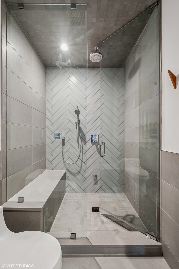 1156 West Ohio Street, Unit 2E Chicago, IL 60642 - Photo 21 of 30 a bathroom with a toilet and a shower