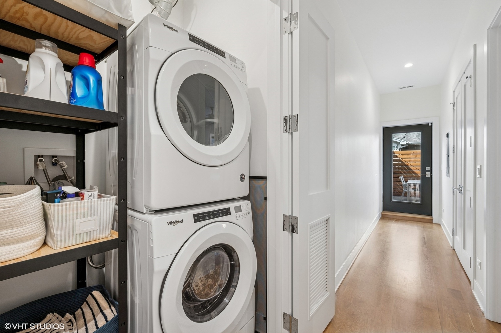 1156 West Ohio Street, Unit 2E Chicago, IL 60642 - Photo 25 of 30 a view of a hallway with washer and dryer