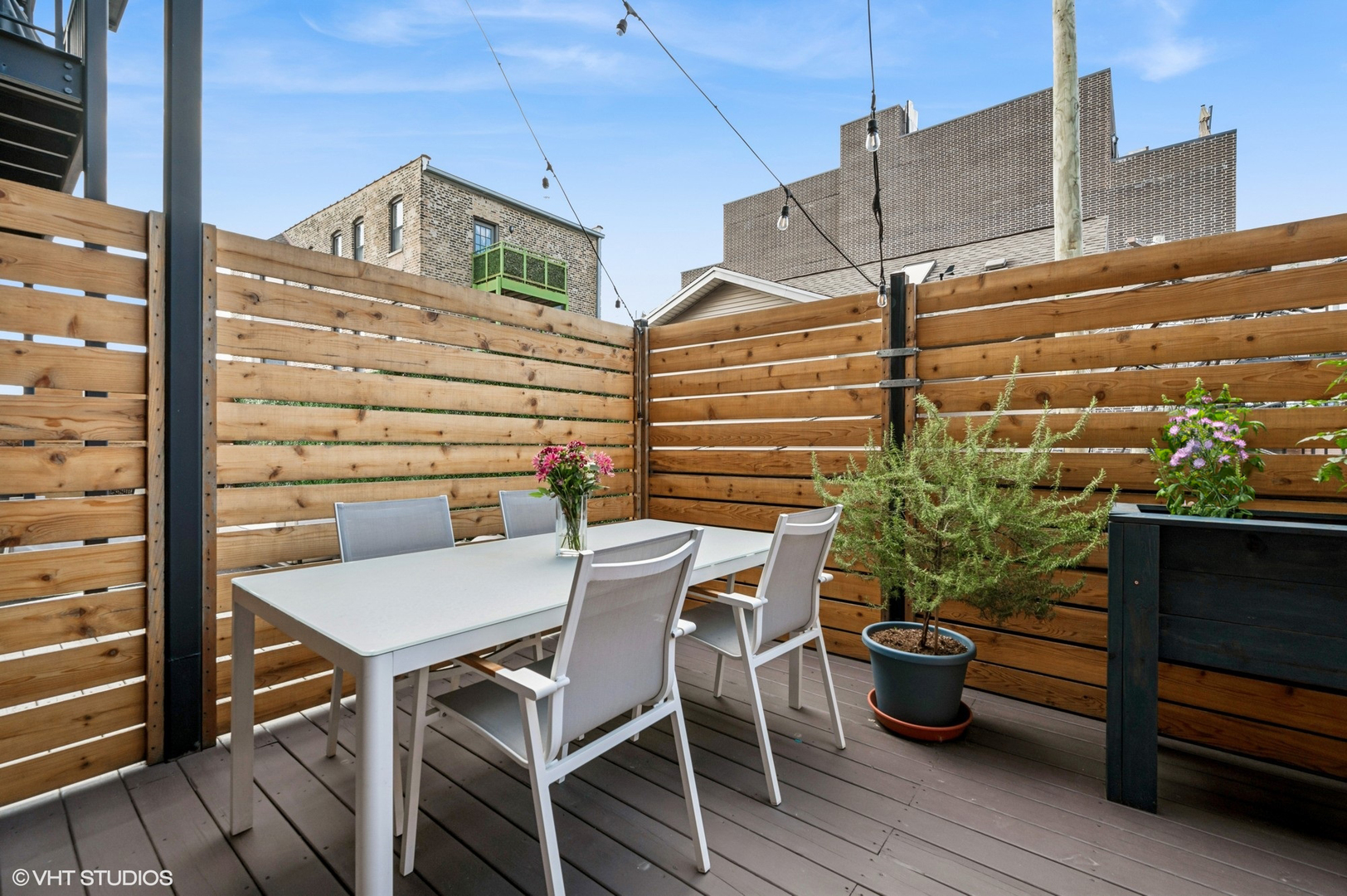 1156 West Ohio Street, Unit 2E Chicago, IL 60642 - Photo 29 of 30 a view of a chairs and table in the balcony