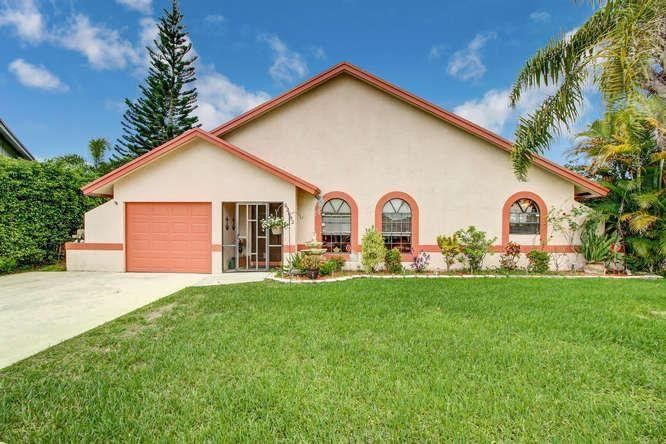22682 Pickerel Circle Boca Raton, FL 33428 - Photo 1 of 20 a view of a house with backyard and garden