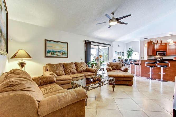 22682 Pickerel Circle Boca Raton, FL 33428 - Photo 12 of 20 a living room with furniture and a view of kitchen