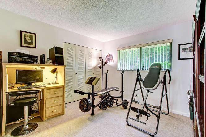 22682 Pickerel Circle Boca Raton, FL 33428 - Photo 20 of 20 a view of a room with gym equipment
