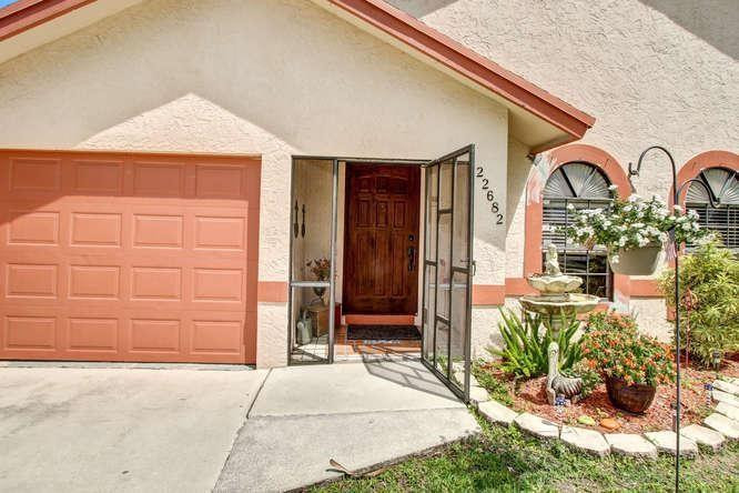 22682 Pickerel Circle Boca Raton, FL 33428 - Photo 2 of 20 a front view of a house
