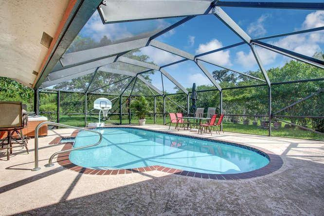 22682 Pickerel Circle Boca Raton, FL 33428 - Photo 3 of 20 a view of a swimming pool with a patio