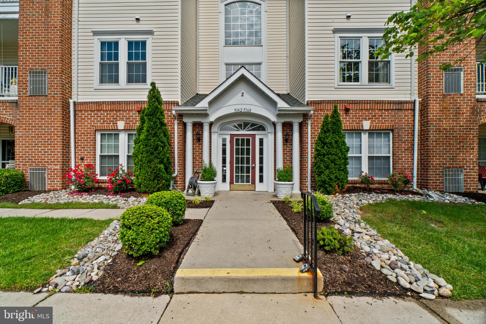 5144 Brightleaf Court, Unit 5144 Rosedale, MD 21237 - Photo 1 of 35 Charming entrance with lush landscaping.