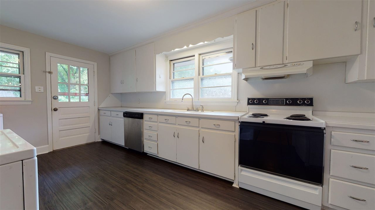 2516 North Roxboro Street Durham, NC 27704 - Photo 6 of 24 Spacious galley kitchen with lots of storage and solid wood cabinets. Kitchen