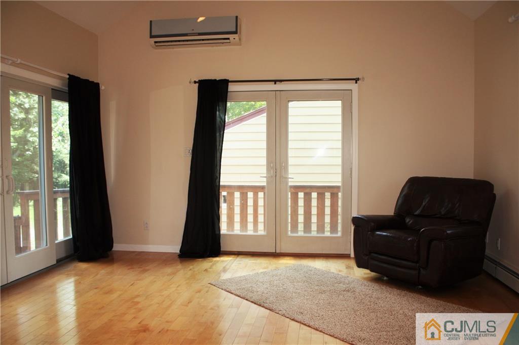 595 Old Post Road Edison, NJ 08817 - Photo 14 of 19 a living room with furniture and large windows