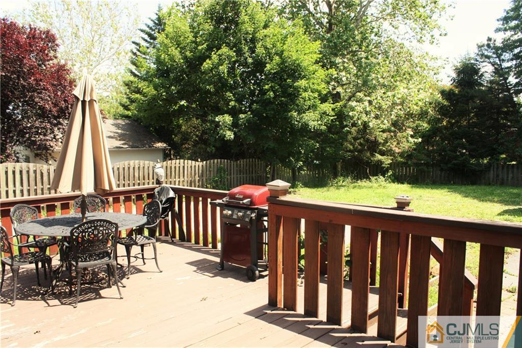 595 Old Post Road Edison, NJ 08817 - Photo 19 of 19 a view of deck with furniture and trees