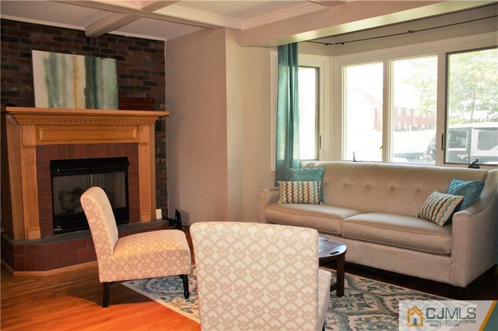 595 Old Post Road Edison, NJ 08817 - Photo 3 of 19 a living room with furniture and a fireplace