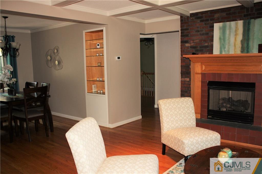 595 Old Post Road Edison, NJ 08817 - Photo 4 of 19 a living room with furniture and a fireplace