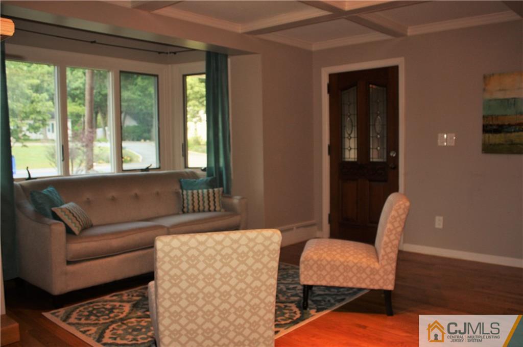 595 Old Post Road Edison, NJ 08817 - Photo 5 of 19 a living room with furniture and a window