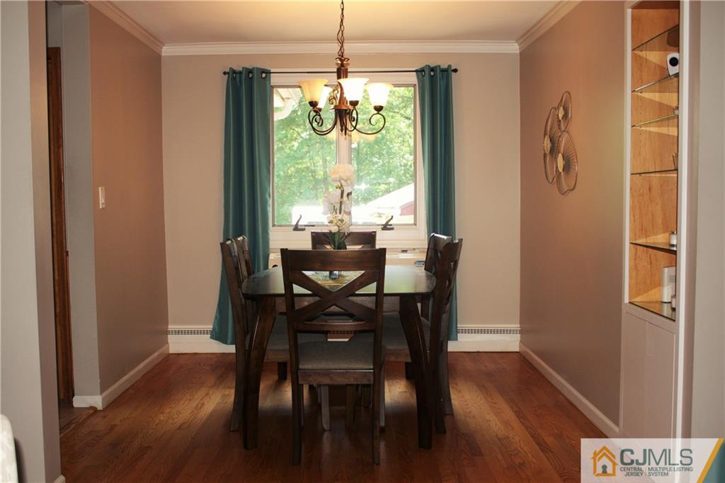 595 Old Post Road Edison, NJ 08817 - Photo 7 of 19 a view of a dining room with furniture window and wooden floor