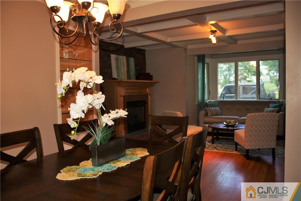 595 Old Post Road Edison, NJ 08817 - Photo 8 of 19 a dining room with furniture lamps and a chandelier