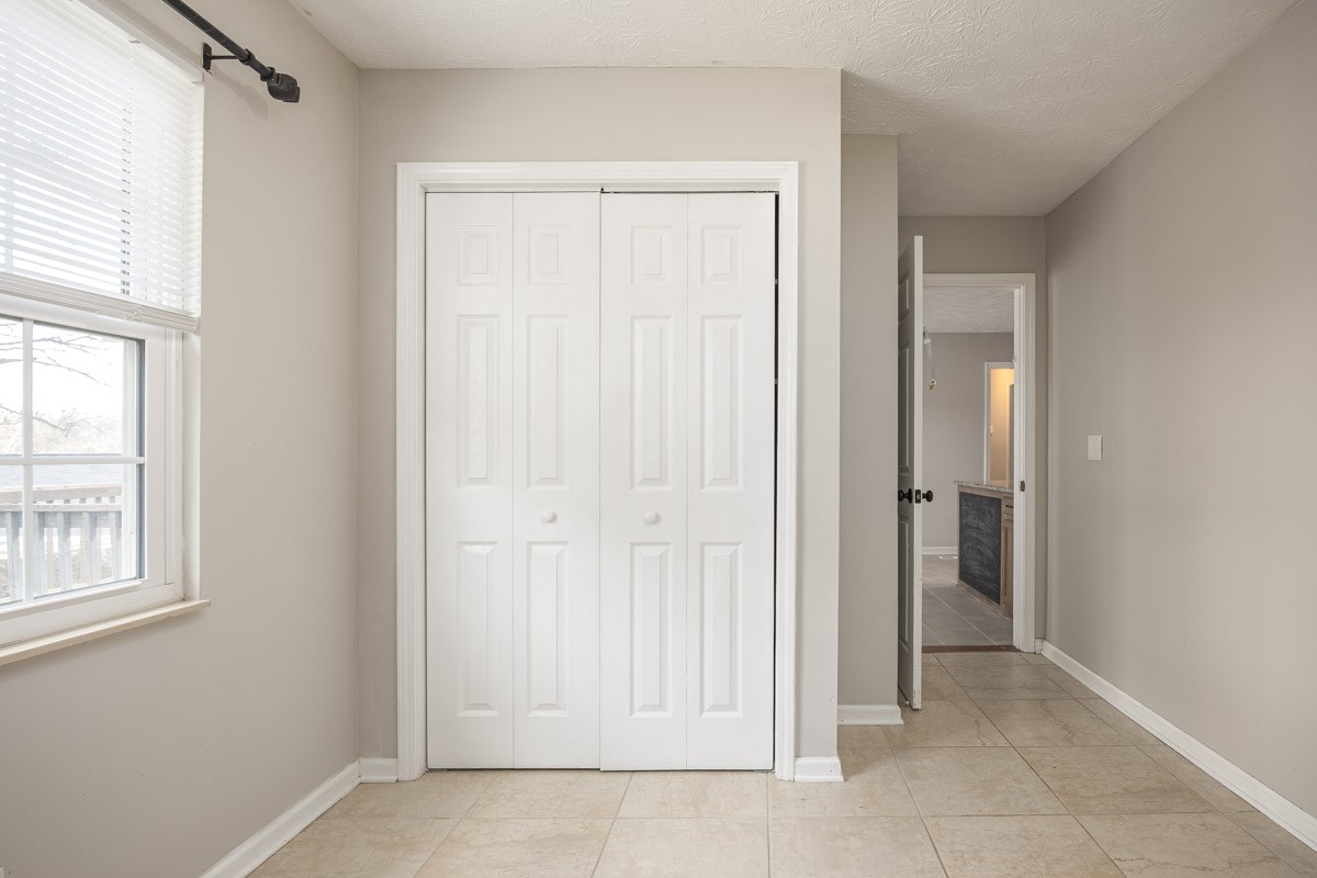 5916 Retriever Court Antioch, TN 37013 - Photo 13 of 30 an empty room with windows and closet