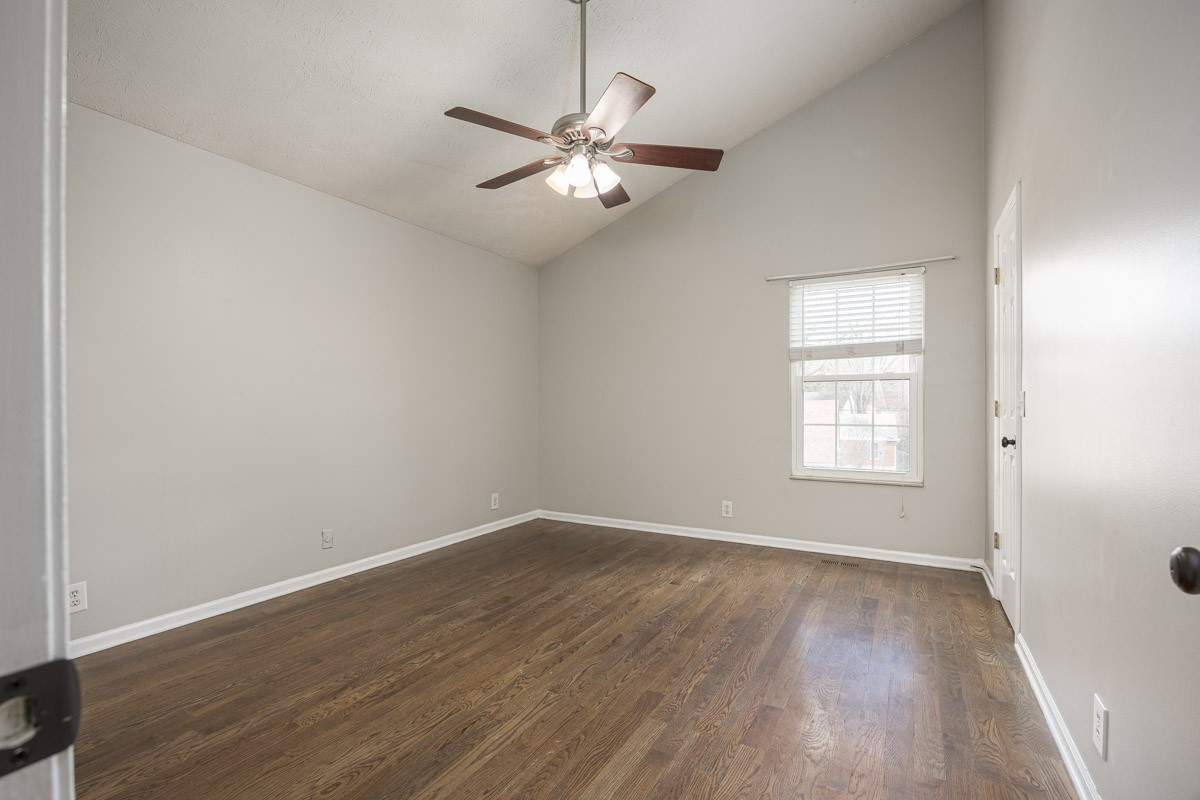 5916 Retriever Court Antioch, TN 37013 - Photo 16 of 30 an empty room with wooden floor fan and windows
