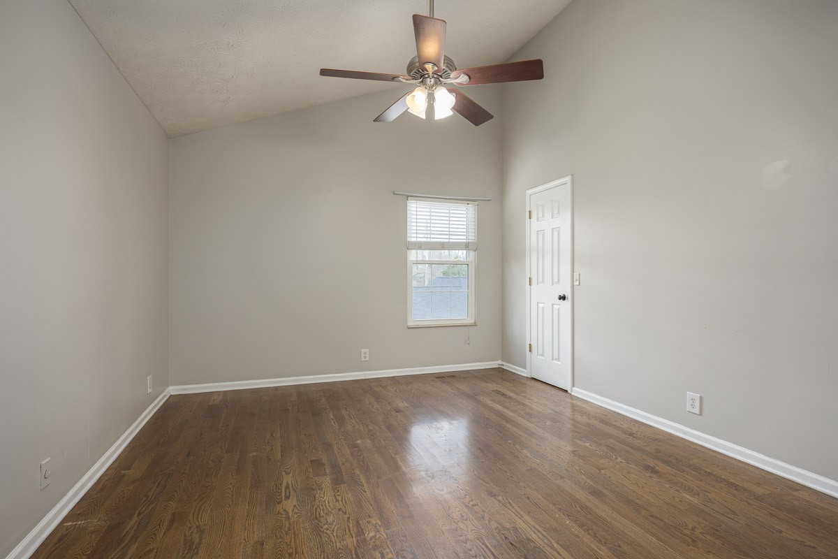 5916 Retriever Court Antioch, TN 37013 - Photo 22 of 30 wooden floor in an empty room with a window