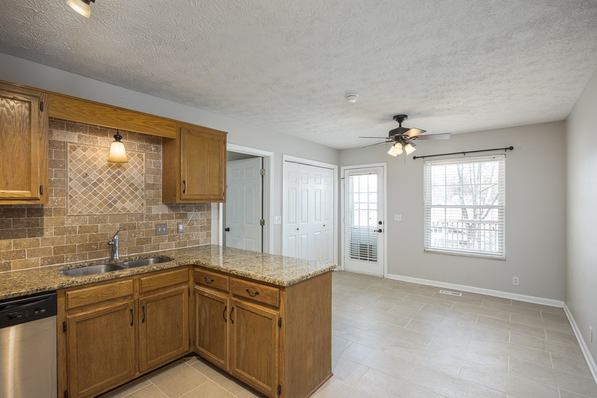 5916 Retriever Court Antioch, TN 37013 - Photo 9 of 30 a spacious bathroom with a granite countertop sink mirror and a bathtub