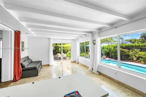 a room with furniture and a large window