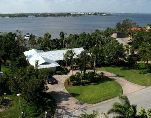 27 North River Road Stuart, FL 34996 - Photo 1 of 8 a view of a lake with a yard and lake view