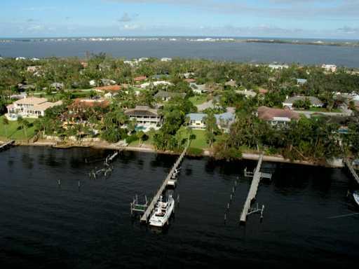 27 North River Road Stuart, FL 34996 - Photo 2 of 8 an aerial view of residential house with outdoor space