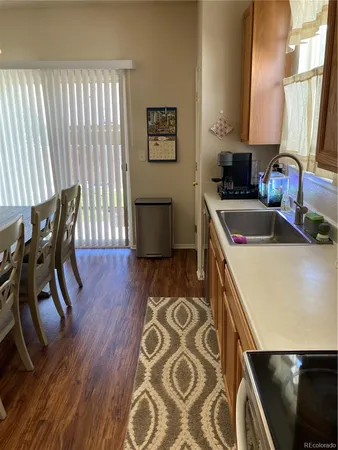 a kitchen that has a microwave a sink and a stove in it