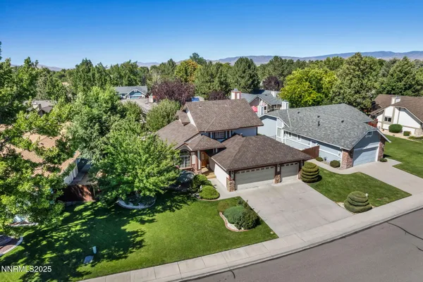 a dining room with furniture a rug and wooden floor