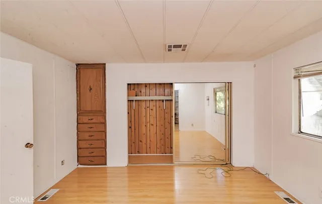 a view of a pathway of a house with wooden floor