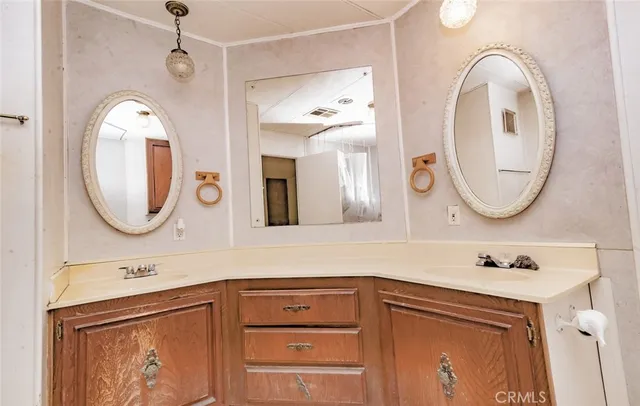 a living room with fireplace furniture and a chandelier