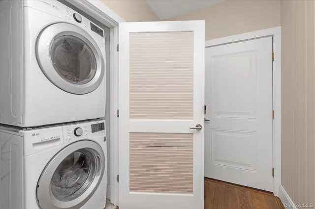 a view of a hallway with washer and dryer