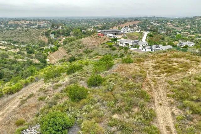 a view of a field with an ocean