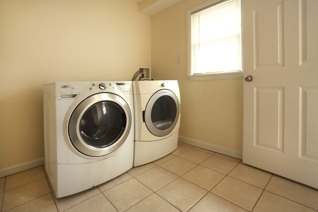151 Turnpike Road Chelmsford, MA 01824 - Photo 16 of 21 a utility room with dryer and washer