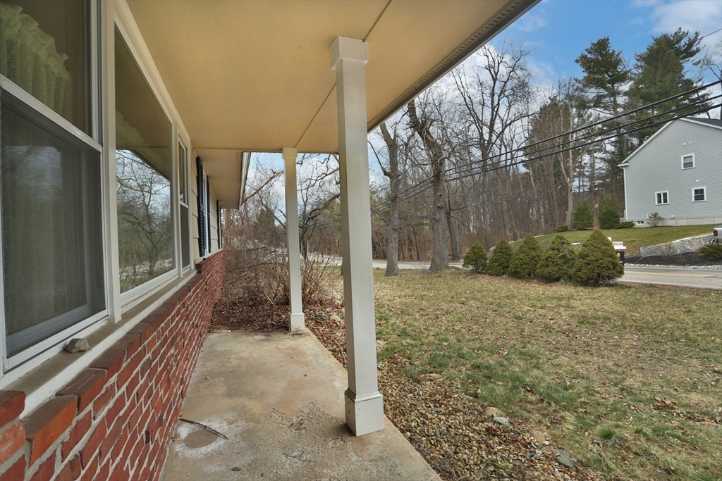 151 Turnpike Road Chelmsford, MA 01824 - Photo 3 of 21 a view of a porch