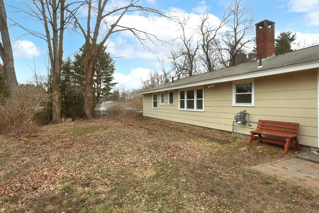 151 Turnpike Road Chelmsford, MA 01824 - Photo 5 of 21 a backyard of a house with a table and chairs