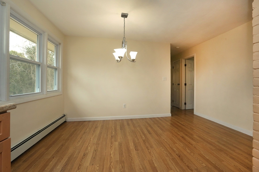 151 Turnpike Road Chelmsford, MA 01824 - Photo 10 of 21 a view of a room with wooden floor and windows