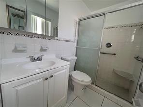 3614 Taylor Street Hollywood, FL 33021 - Photo 7 of 20 a bathroom with a sink a toilet and shower