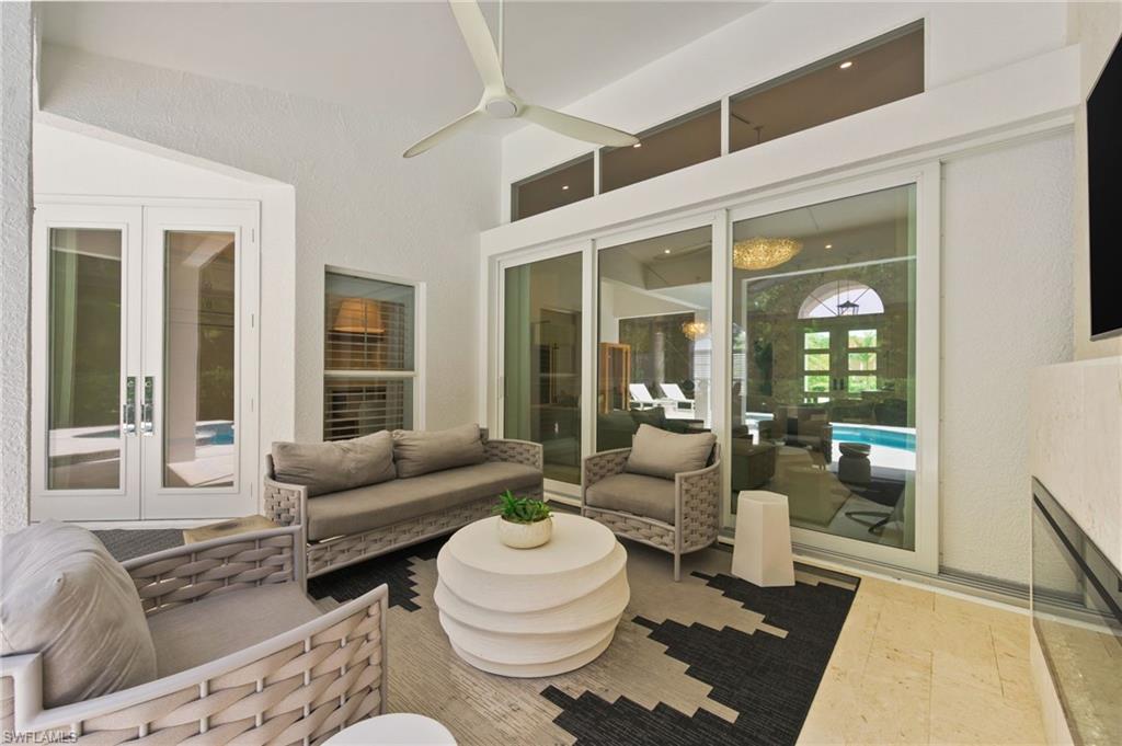 6689 Mill Run Road Naples, FL 34109 - Photo 15 of 37 a living room with furniture and a large window