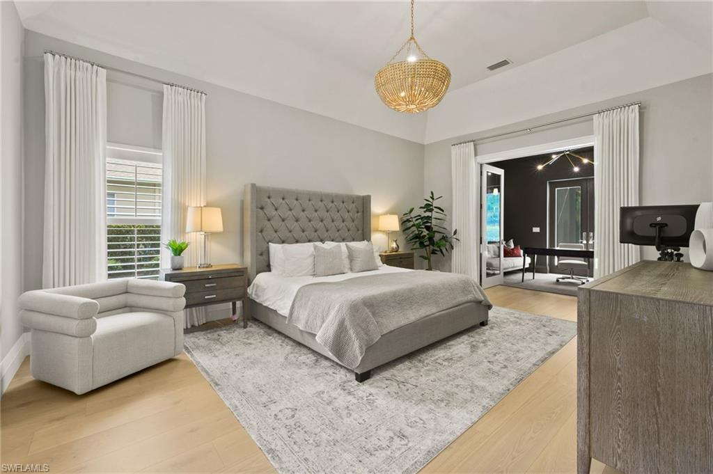 6689 Mill Run Road Naples, FL 34109 - Photo 18 of 37 a spacious bedroom with a bed and couch