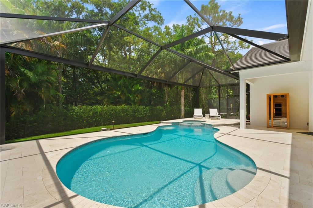 6689 Mill Run Road Naples, FL 34109 - Photo 26 of 37 a view of a swimming pool with a patio and a yard