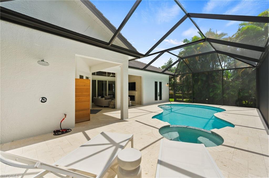 6689 Mill Run Road Naples, FL 34109 - Photo 27 of 37 a swimming pool with a outdoor seating