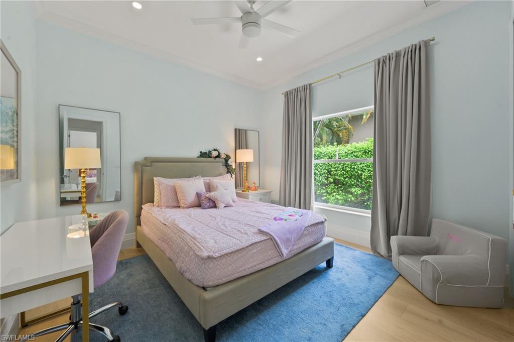 6689 Mill Run Road Naples, FL 34109 - Photo 32 of 37 a bedroom with a bed couch and a window