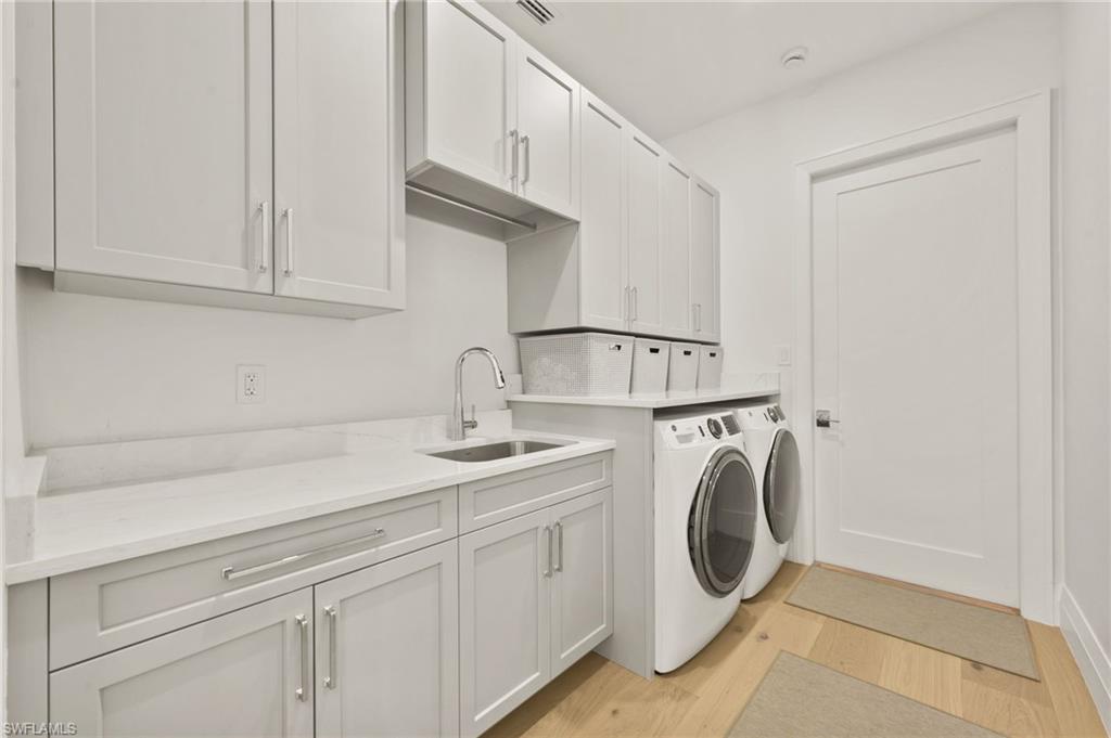 6689 Mill Run Road Naples, FL 34109 - Photo 36 of 37 a utility room with dryer and washer