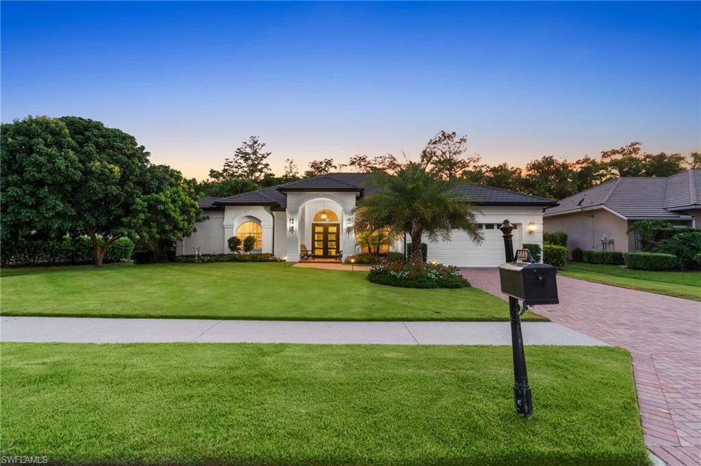 6689 Mill Run Road Naples, FL 34109 - Photo 37 of 37 a front view of a house with a yard