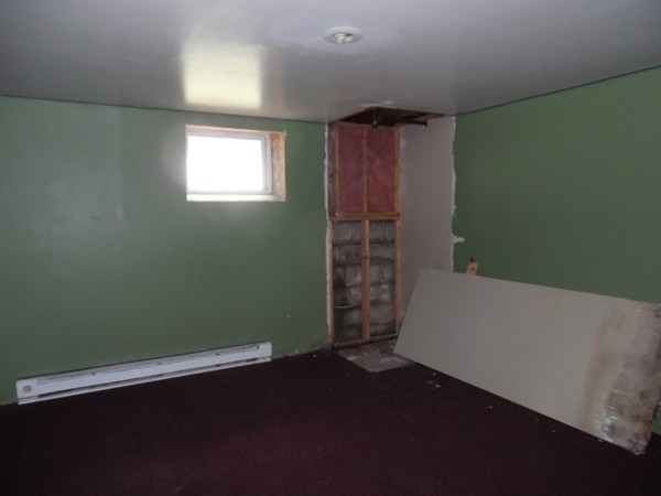 135 Columbia Road Lowell, MA 01854 - Photo 11 of 12 a view of wooden floor and windows in a room