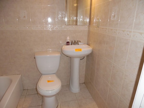 135 Columbia Road Lowell, MA 01854 - Photo 12 of 12 a bathroom with a sink toilet and shower